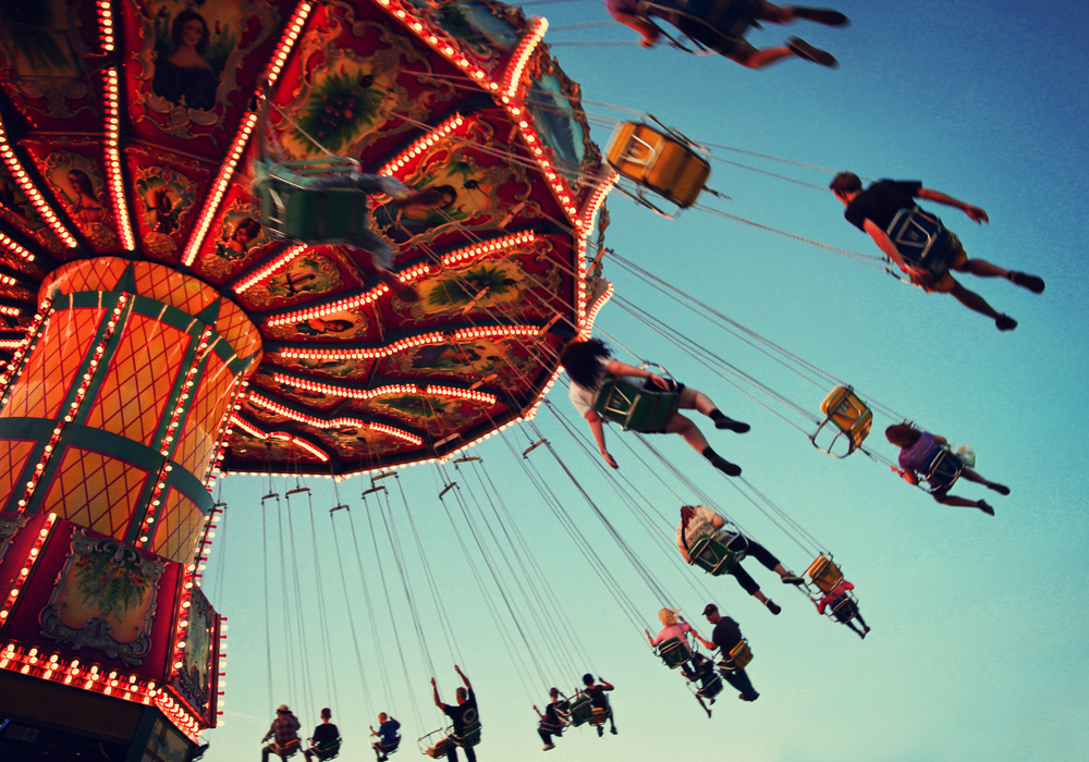 A,Swinging,Fair,Ride,At,Dusk,Toned,With,A,Retro